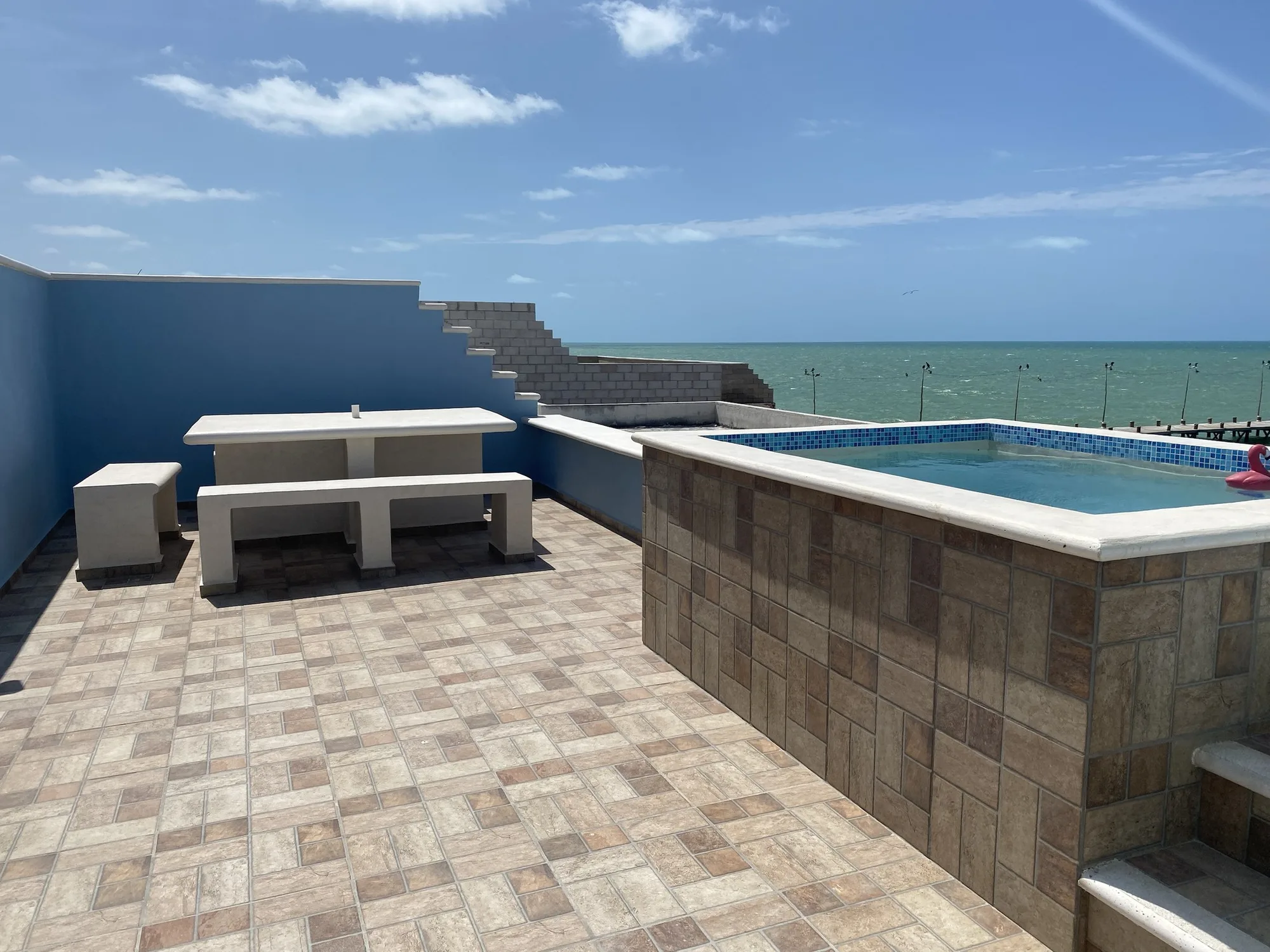 Beachfront Apartment — rooftop pool and sea view